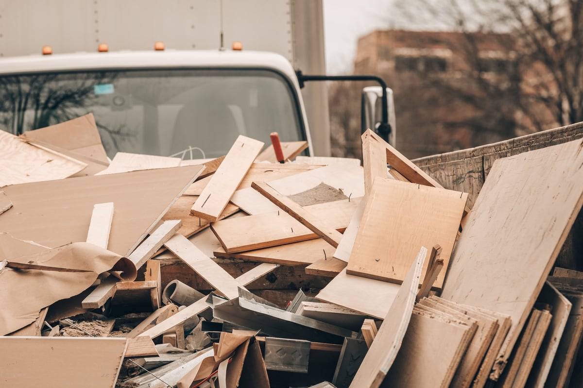 Junk removal work van and debris