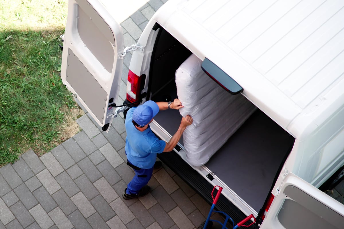 Cleanout crew loading a truck with haul-away items