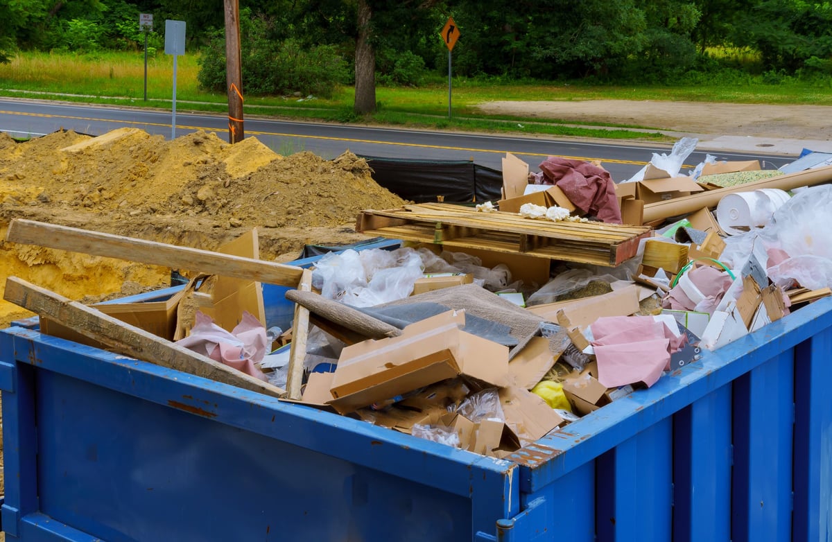 Construction debris container filled with rubble